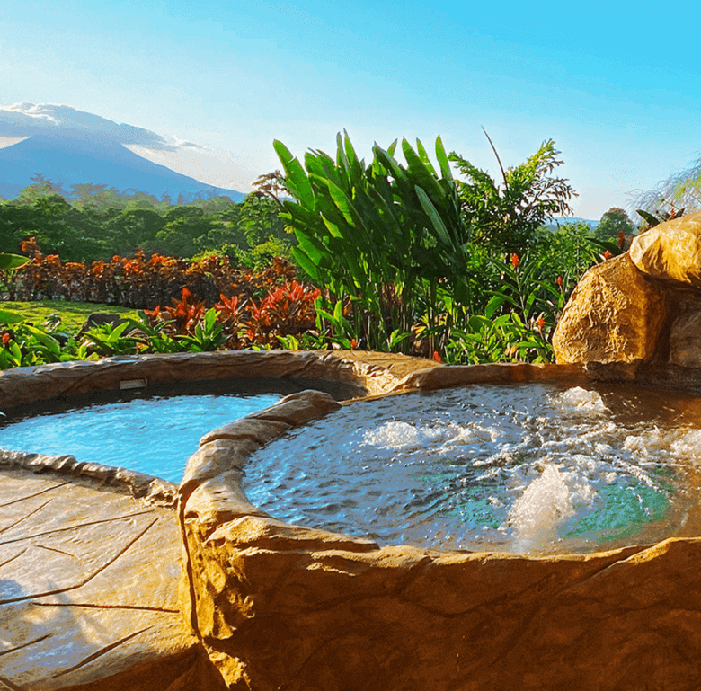 Beautiful hot springs with lush tropical scenery and volcano views in La Fortuna, Costa Rica.