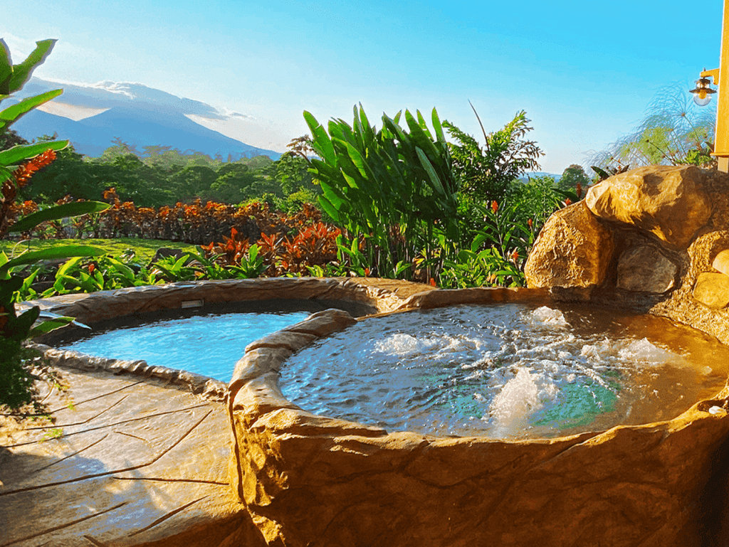 Beautiful hot springs with lush tropical scenery and volcano views in La Fortuna, Costa Rica.