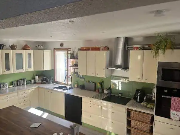 Cozy renovated kitchen with modern appliances and scenic views in a village house in Ria-Sirach, Fra.