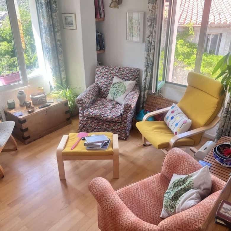 Bright living room with large windows and scenic views in Ria-Sirach, France.