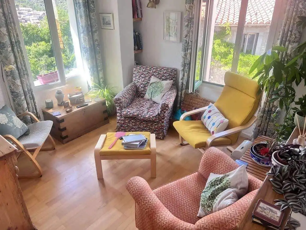 Cozy Village House Living Room Bright living room with large windows and scenic views in Ria-Sirach, France.