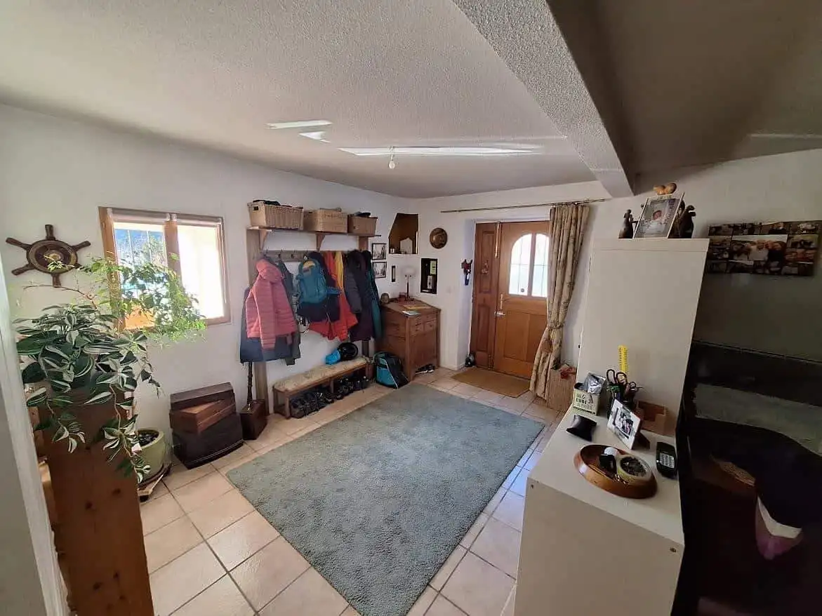 Cozy Village House Interior Inviting entrance hall of a renovated village house with wooden accents and cozy decor.