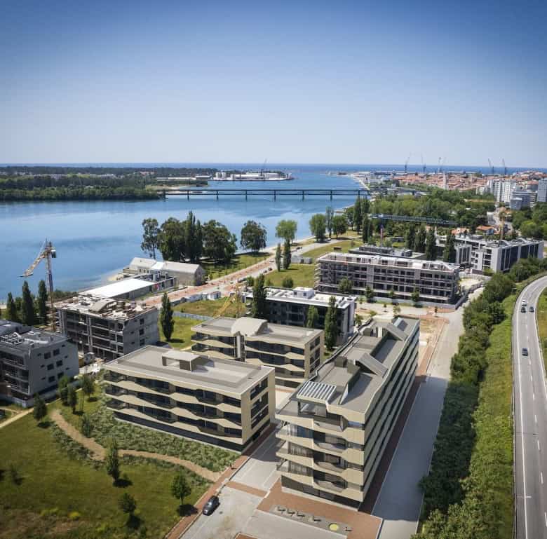 Modern residential buildings in Viana do Castelo overlooking the river.