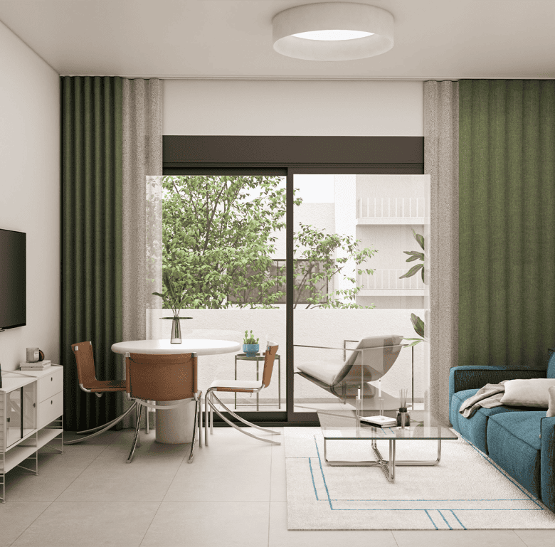 Bright living room with large glass doors opening to a balcony with greenery.