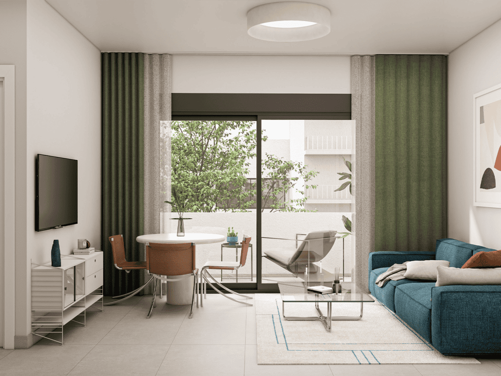 Bright living room with large glass doors opening to a balcony with greenery.