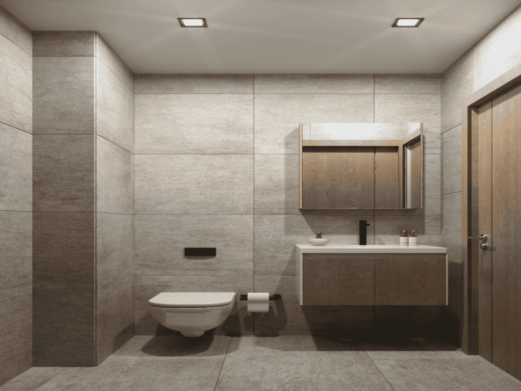 Bathroom with beige tiles, wall-mounted toilet, and wooden vanity.