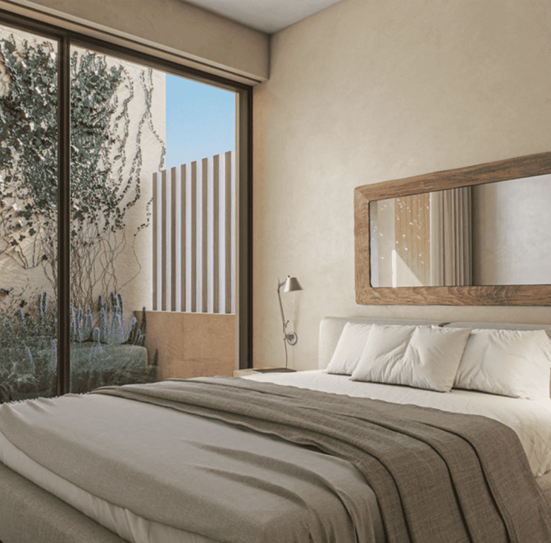 Spacious bedroom featuring a large window with garden views, modern decor, and natural light in Port.
