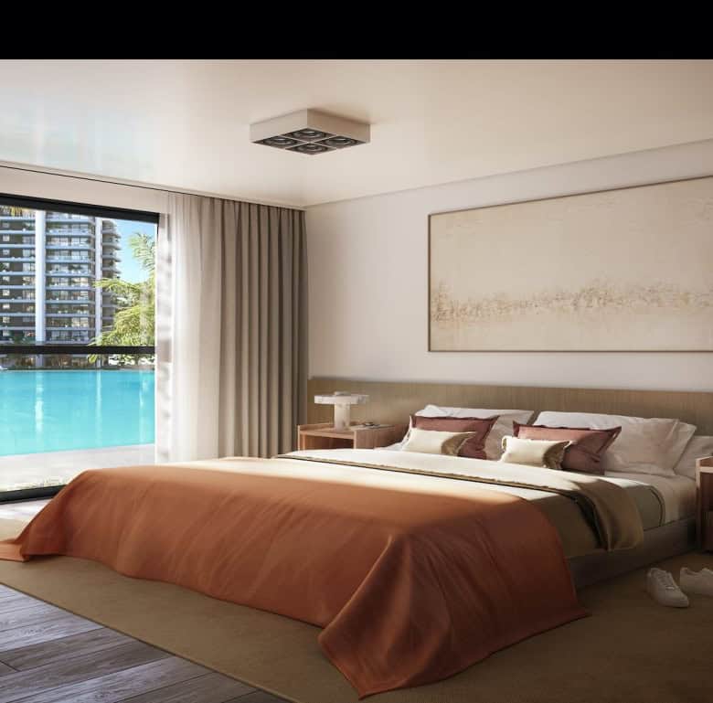 Elegant bedroom overlooking the Crystal Lagoon in Asuncion, Paraguay.