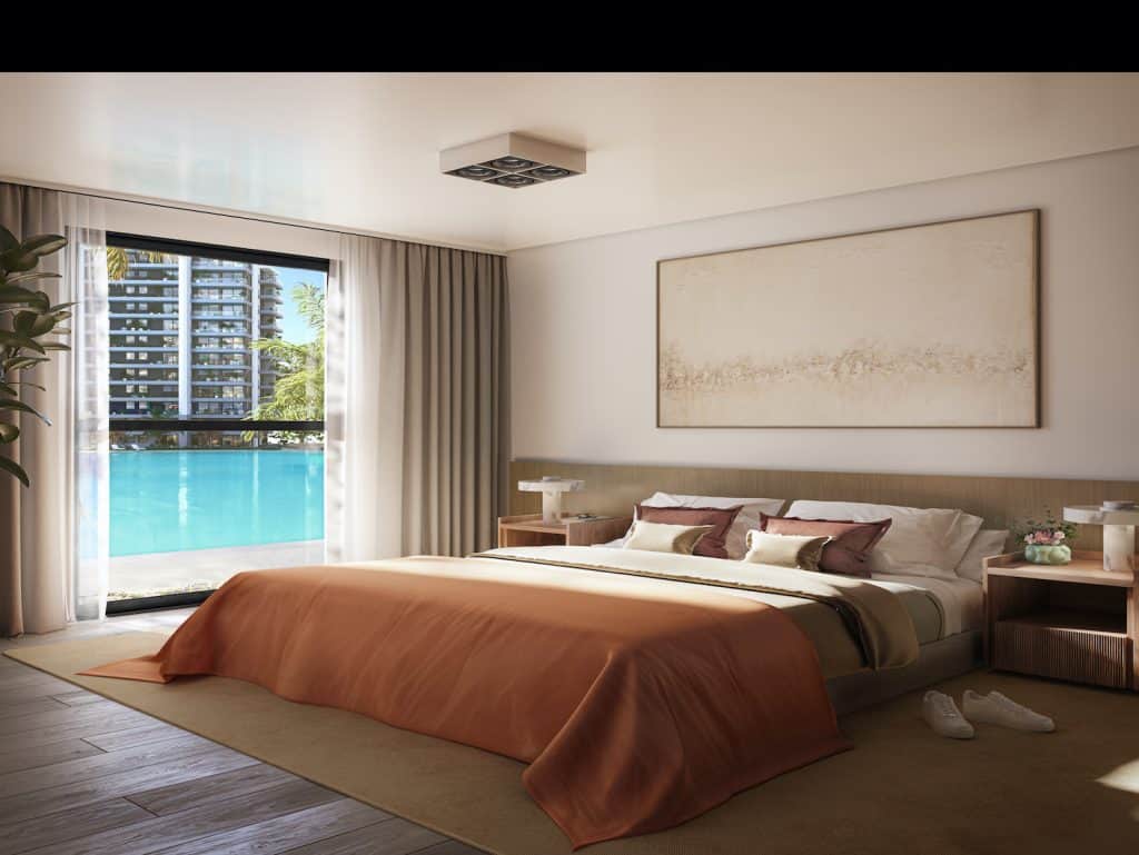 Elegant bedroom overlooking the Crystal Lagoon in Asuncion, Paraguay.
