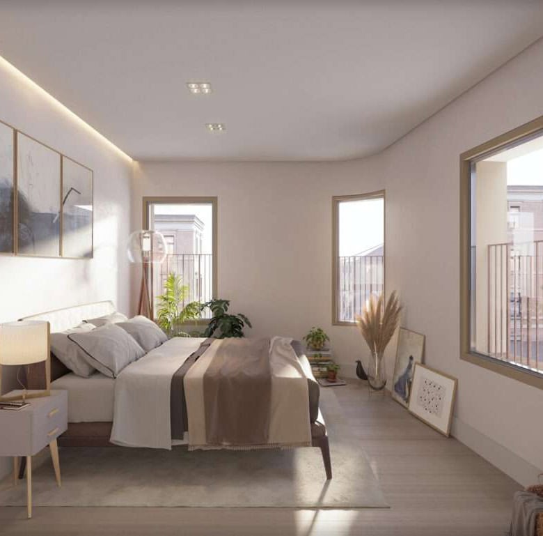 Bright, airy bedroom with large windows and minimalist decor in Peniche, Portugal.