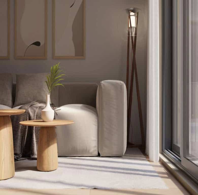 Bright living space with cozy sofa, wooden side tables, and stylish decor.