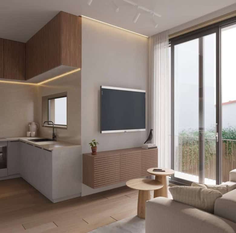 Bright interior of Mare - Peniche, Portugal, featuring a contemporary living room and open kitchen.