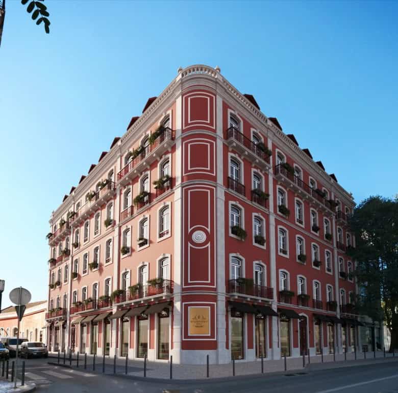 Elegant Renaissance-style building in Lisbon with ornate details and balconies.