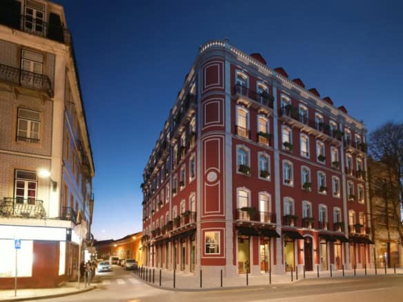 Historic Renaissance-style building in Lisbon at dusk.