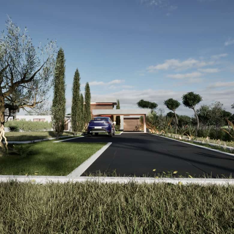 Contemporary villa entrance with driveway and lush garden in Setubal, Portugal.