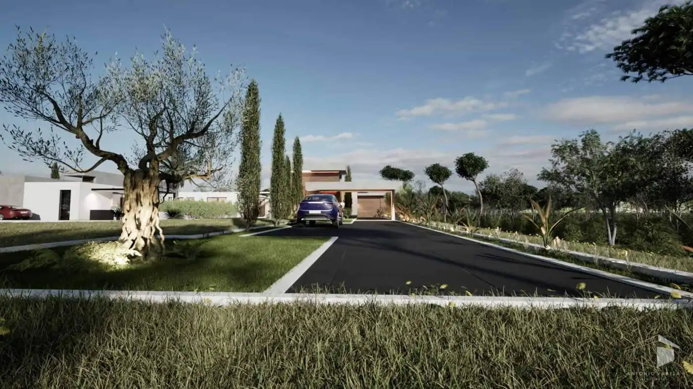Contemporary villa entrance with driveway and lush garden in Setubal, Portugal.