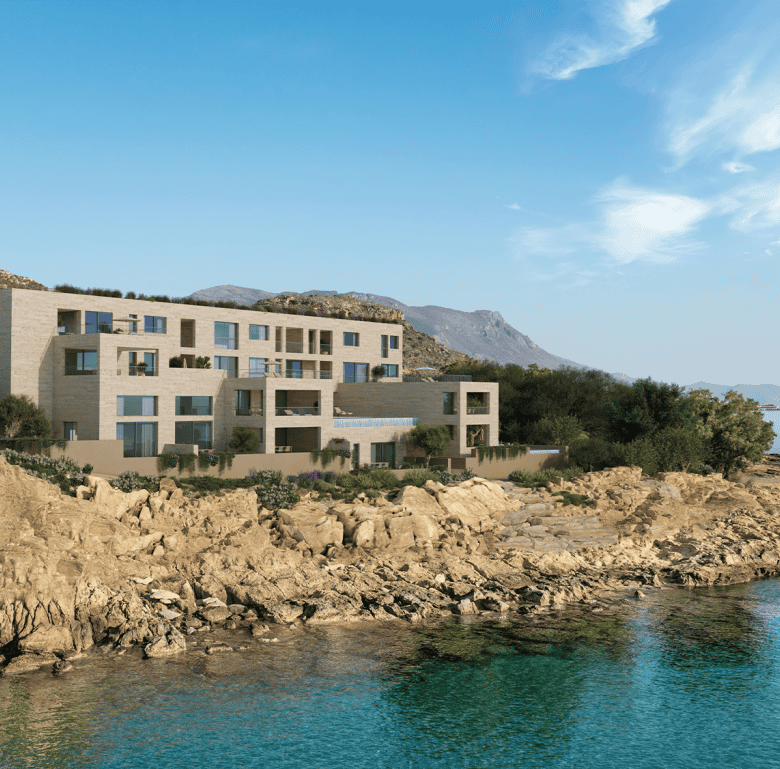 Modern waterfront apartment building in Kissamos, Crete, overlooking the sea with scenic mountain vi.