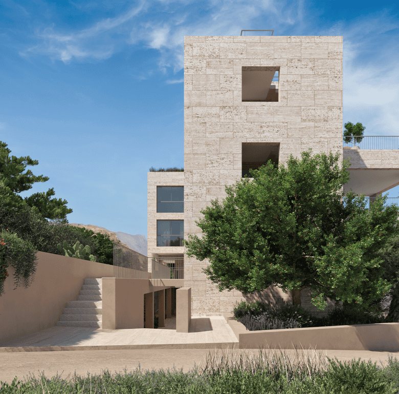 Modern waterfront building in Kissamos, Crete with lush greenery and scenic sea views.