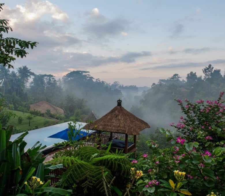 Scenic view of a tropical garden and gazebo in a luxury villa in Ubud Bali, Indonesia.