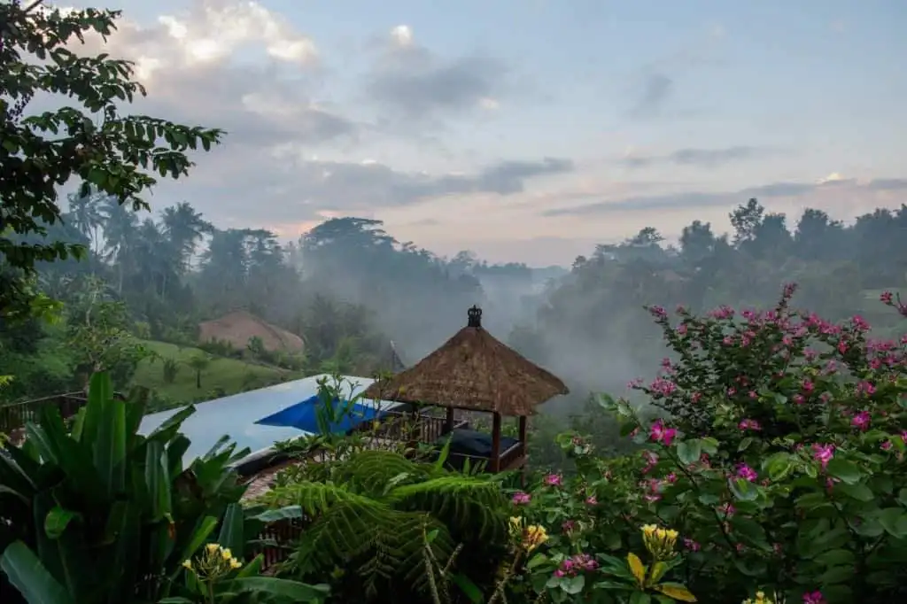 Luxury Ubud Bali Villa with Tropical Garden Views Scenic view of a tropical garden and gazebo in a luxury villa in Ubud Bali, Indonesia.