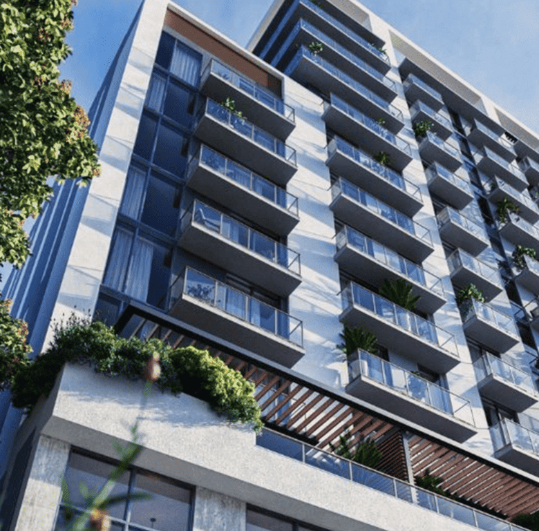 Luxury Brickell Miami apartment with glass balconies and urban greenery.