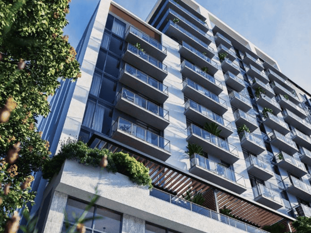 Luxury Brickell Miami apartment with glass balconies and urban greenery.