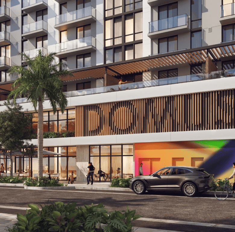 Modern Brickell Miami residential building with retail space and outdoor seating.