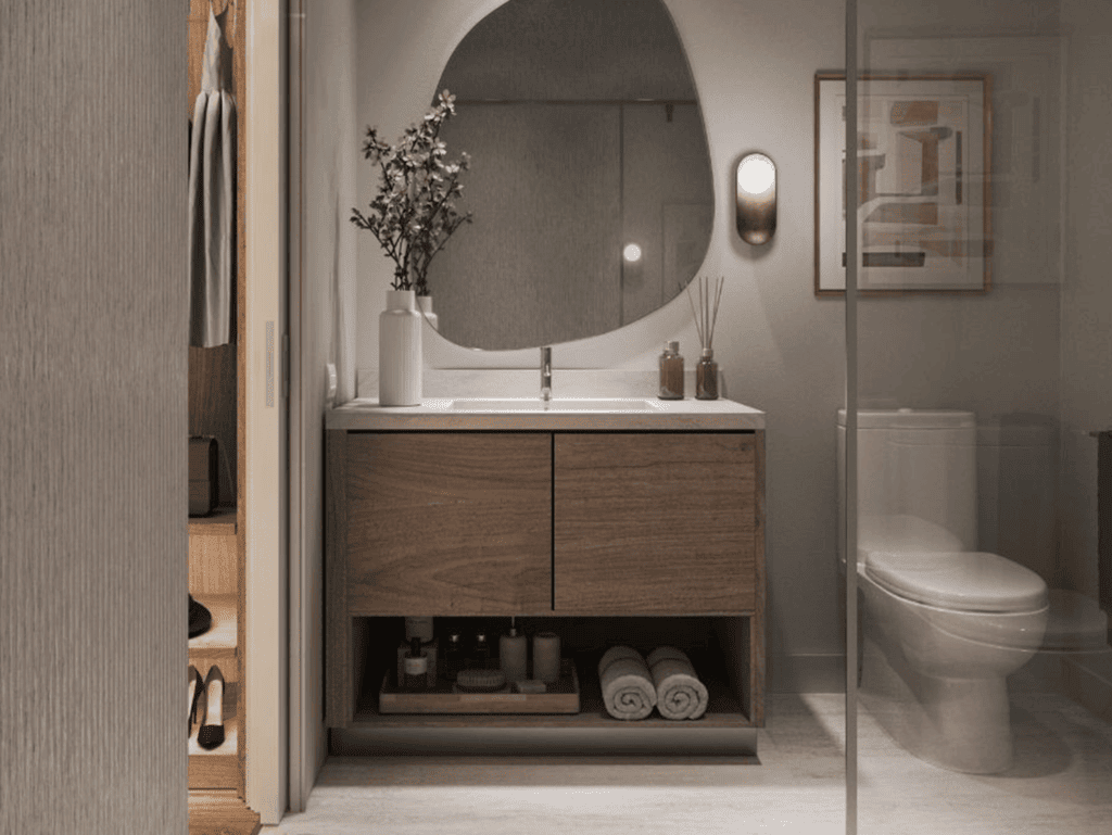 Elegant bathroom featuring a wooden vanity, mirror, and contemporary fixtures in Brickell, Miami.
