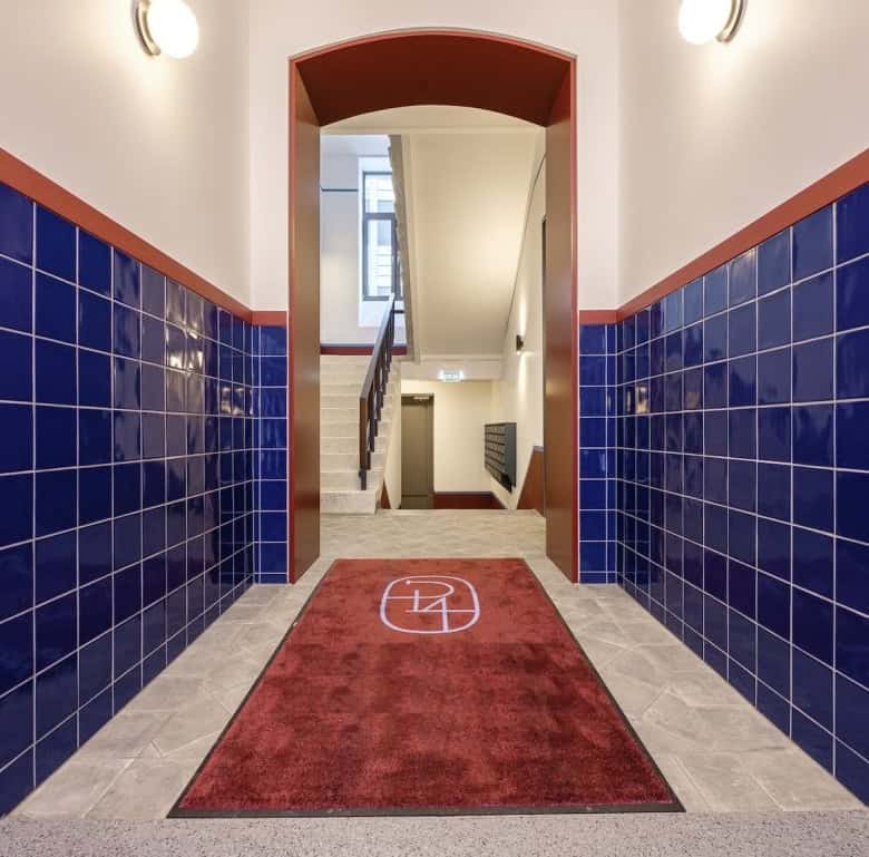 Bright hallway with staircase leading to upper floors in Marijas 4, Riga.