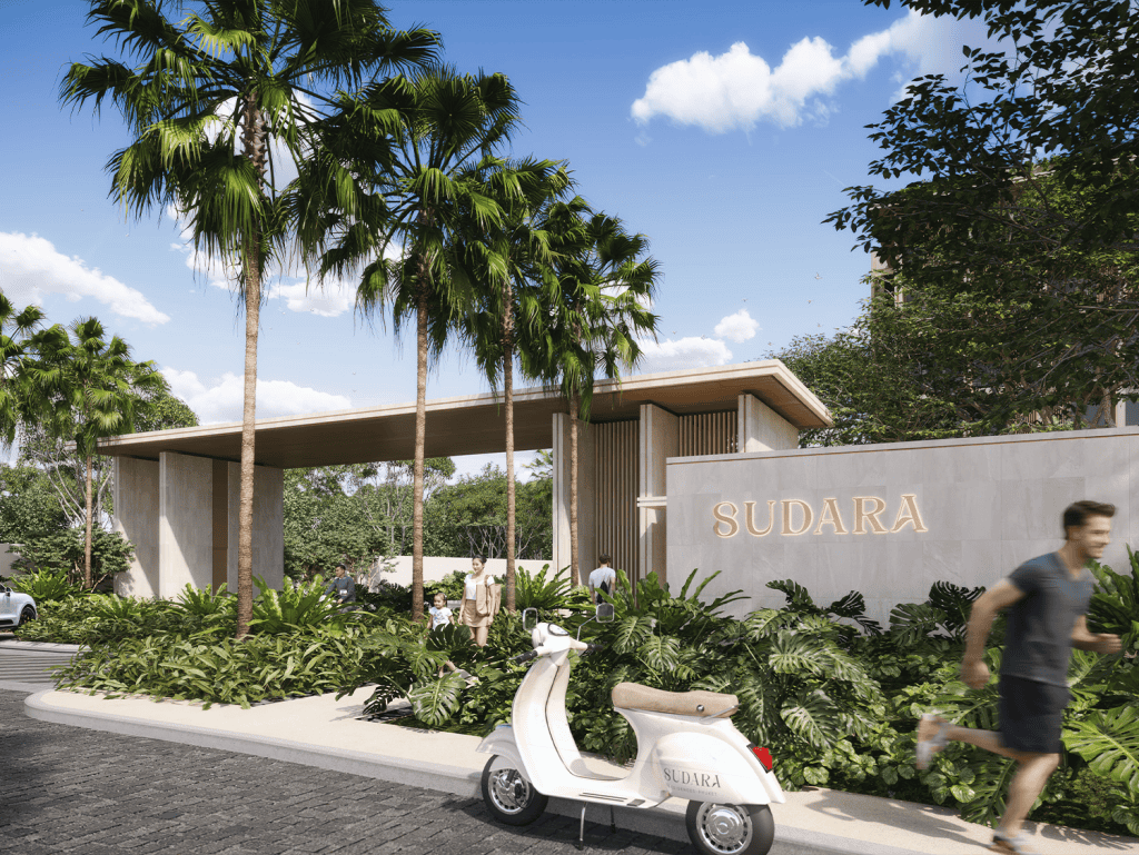 Modern entrance to Sudara in Phuket, Thailand with lush greenery and a scooter in front.