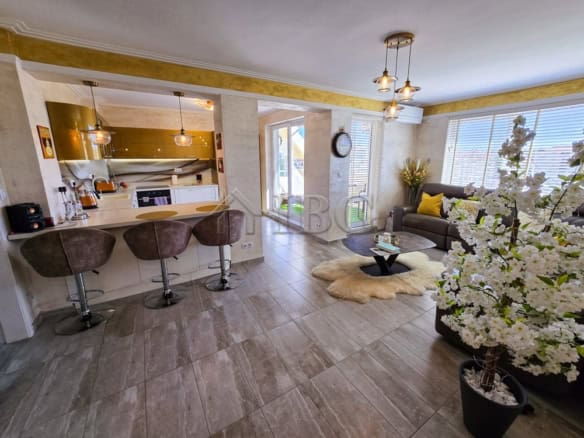 Bright living room with modern decor and large windows in Sea Dreams, Sunny Beach.