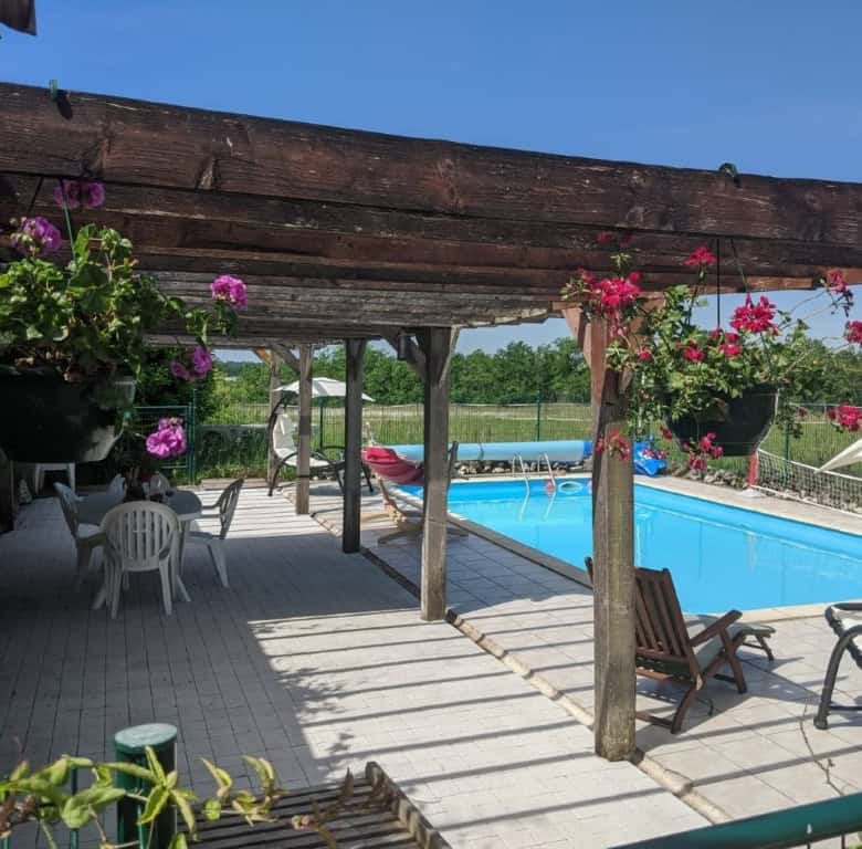 Equestrian property with pool, garden, and outdoor seating in Chatignac, France. Perfect for luxury.