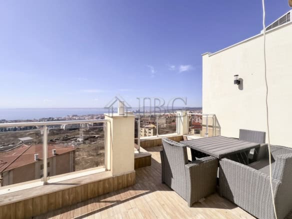 Sea view balcony with outdoor seating in Sveti Vlas. Perfect for relaxing and enjoying panoramic oce.