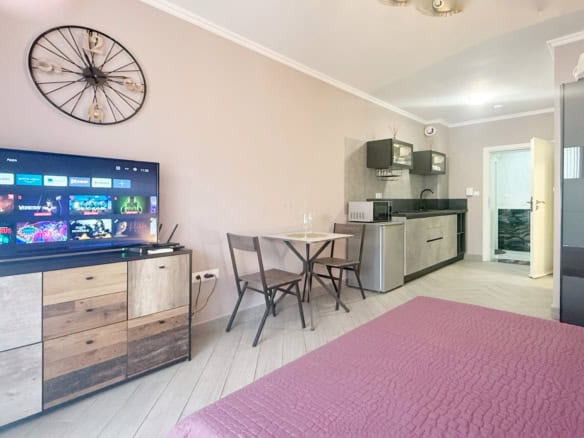 Bright studio apartment in Valencia Gardens, Nessebar, featuring a living area, kitchenette, and coz.