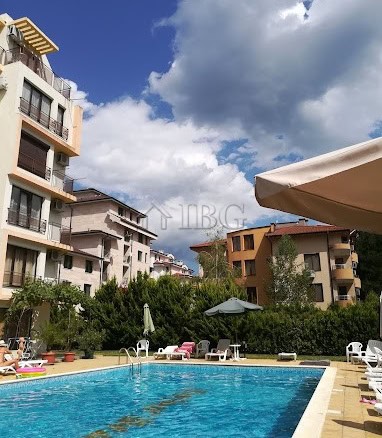 Pool view of Amber Beach Complex in Sunny Beach with modern apartments and a relaxing swimming pool.