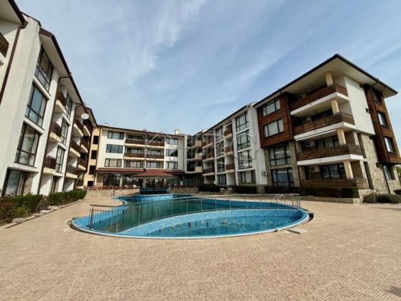 Bright one-bedroom apartment for sale in Nessebar, Bulgaria, featuring a communal pool and contempor.