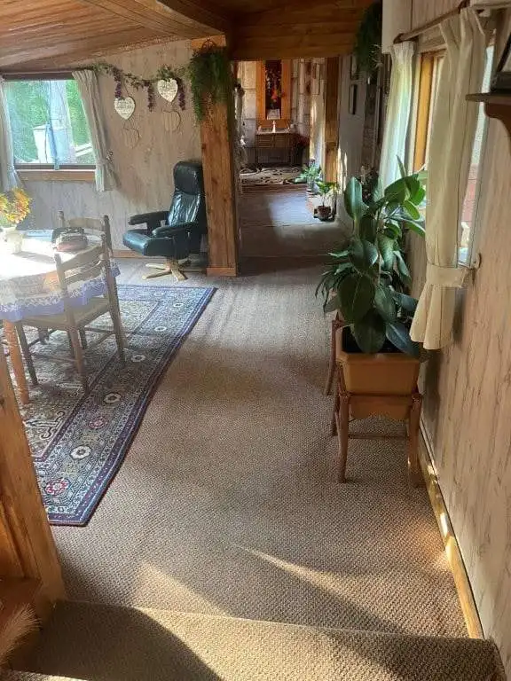 Cozy interior of a country house with wooden accents and natural light in Traykovo, Bulgaria.