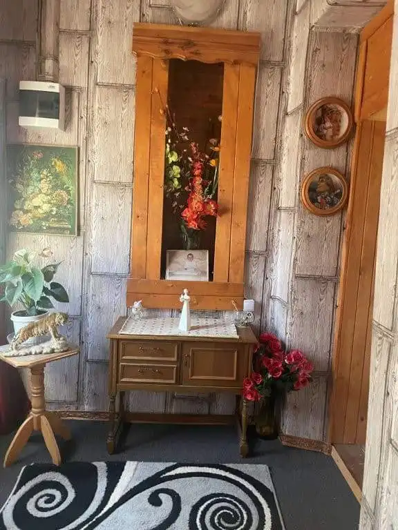 Cozy country house interior with wooden accents and floral decor in Traykovo, Bulgaria.