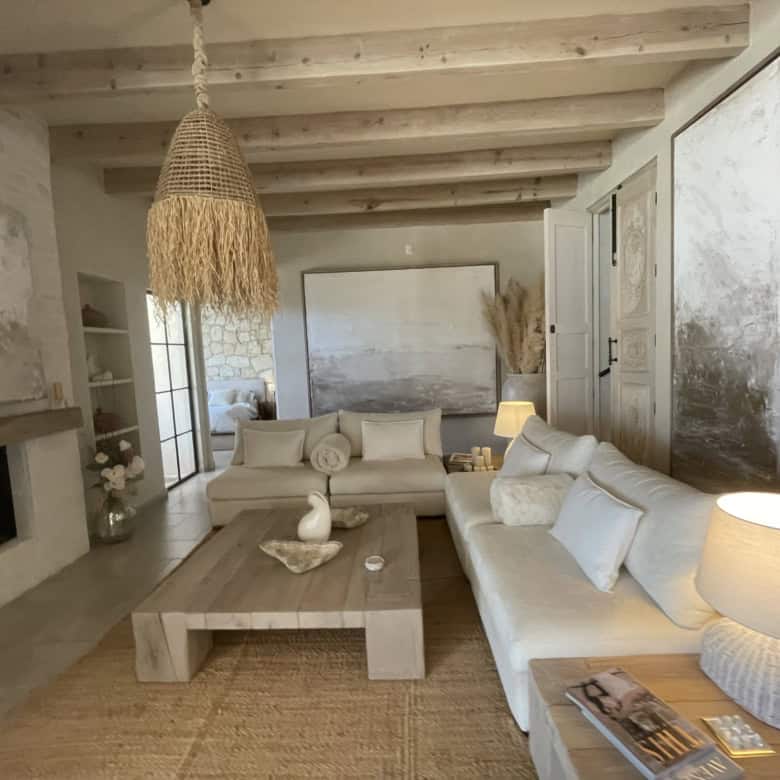 Cozy living room featuring rustic decor, wooden beams, and natural light for a warm, inviting atmosp.