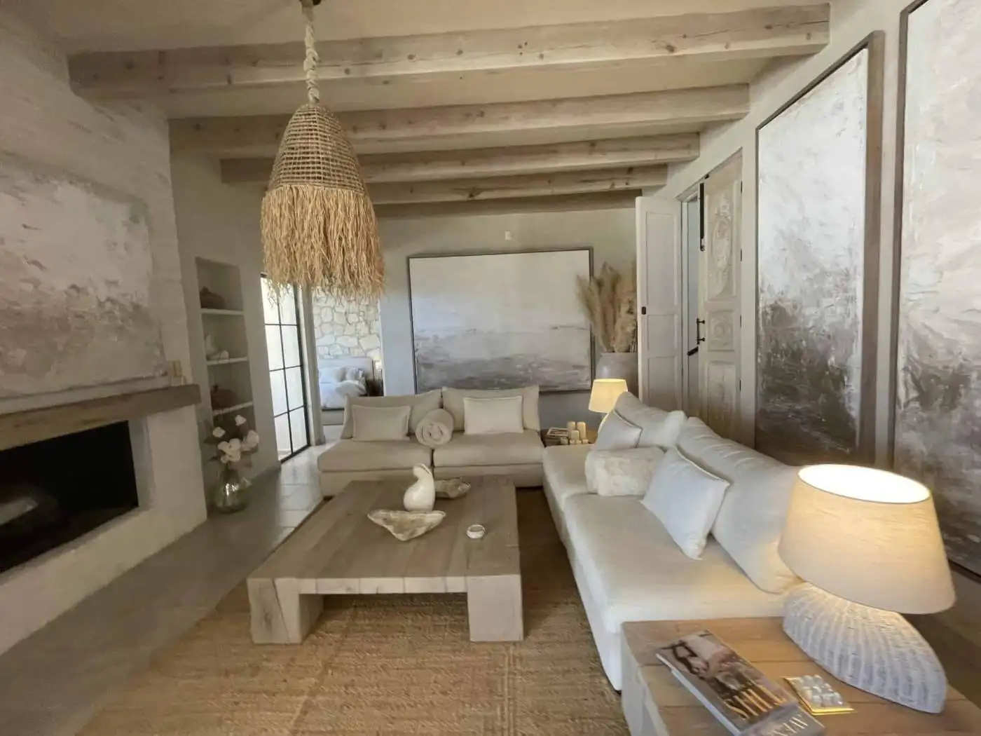 Cozy living room featuring rustic decor, wooden beams, and natural light for a warm, inviting atmosp.