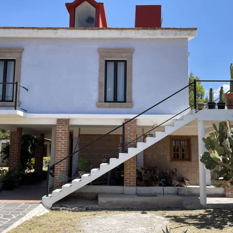 Beautiful two-story house with modern design and outdoor cactus garden. Perfect for buyers seeking a.