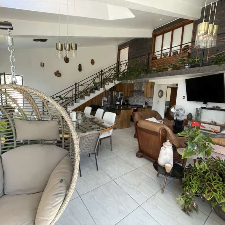Modern living room with stylish furniture and open-plan design.