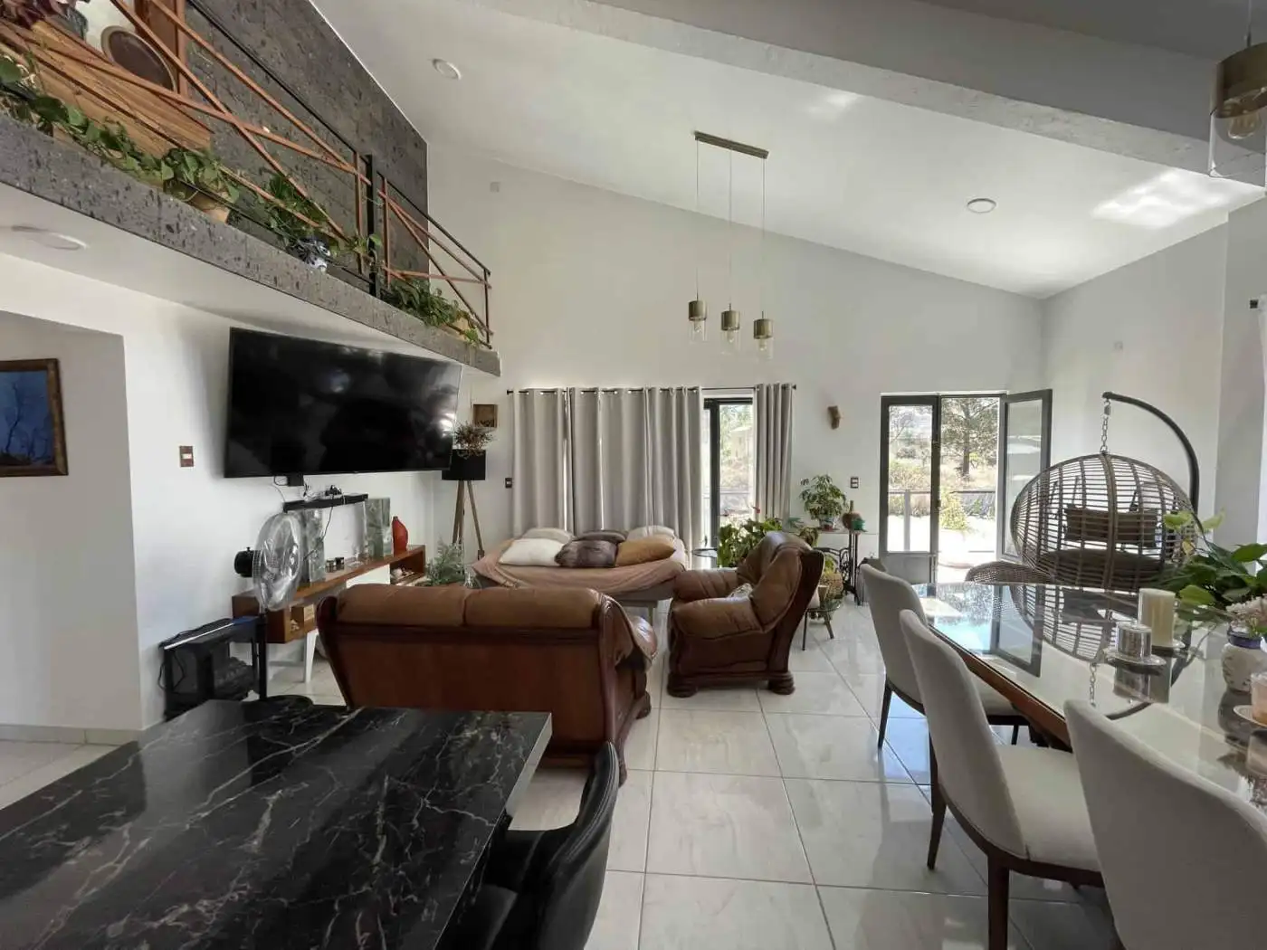 Bright and airy living room with comfortable furniture and natural light.