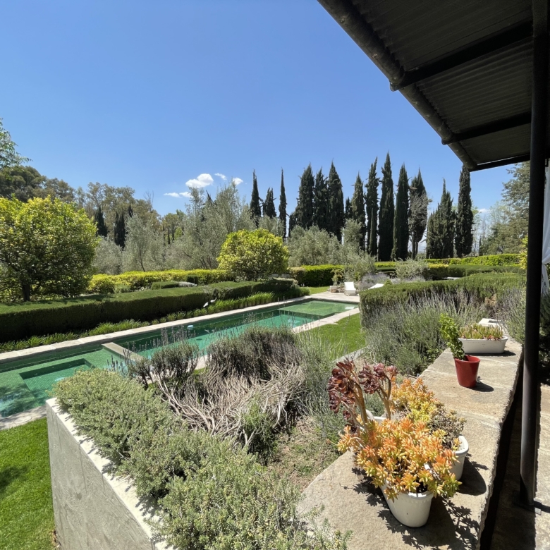 Luxury garden with pool and scenic landscape in Spain.