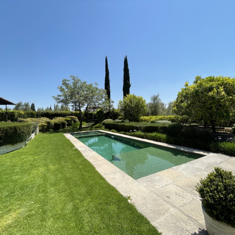 Luxury villa with private pool and lush garden for sale.