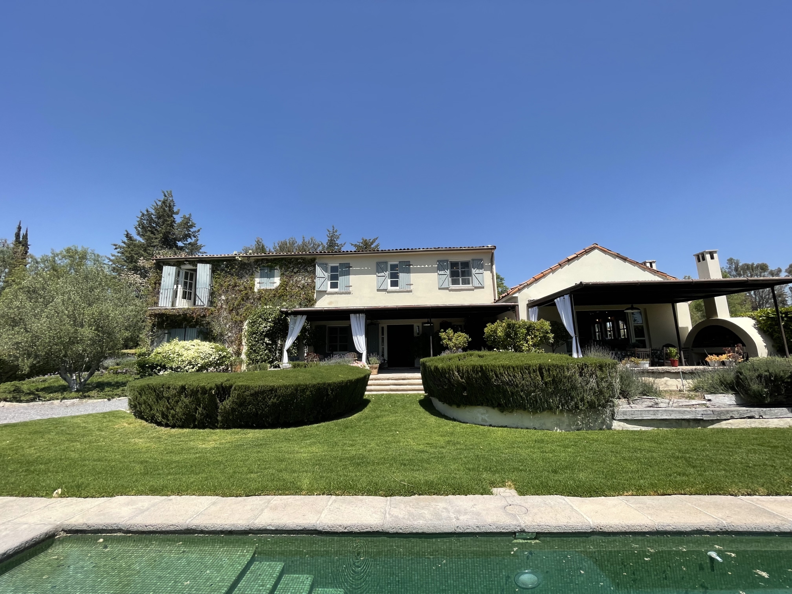 Luxury villa with swimming pool and landscaped garden in a serene setting.
