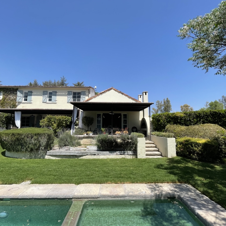 Luxury villa with private pool and lush garden in a serene setting.