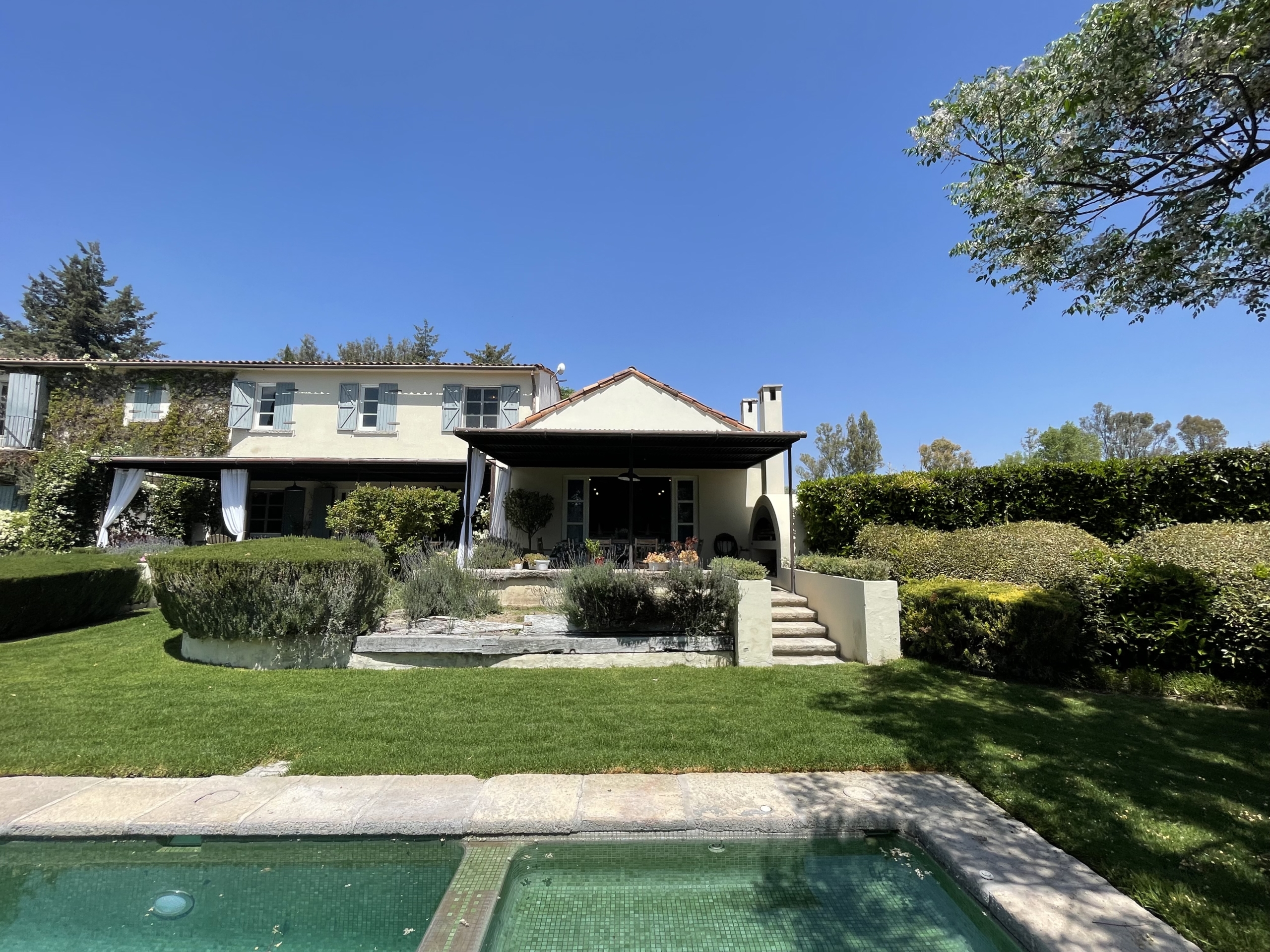 Luxury villa with private pool and lush garden in a serene setting.