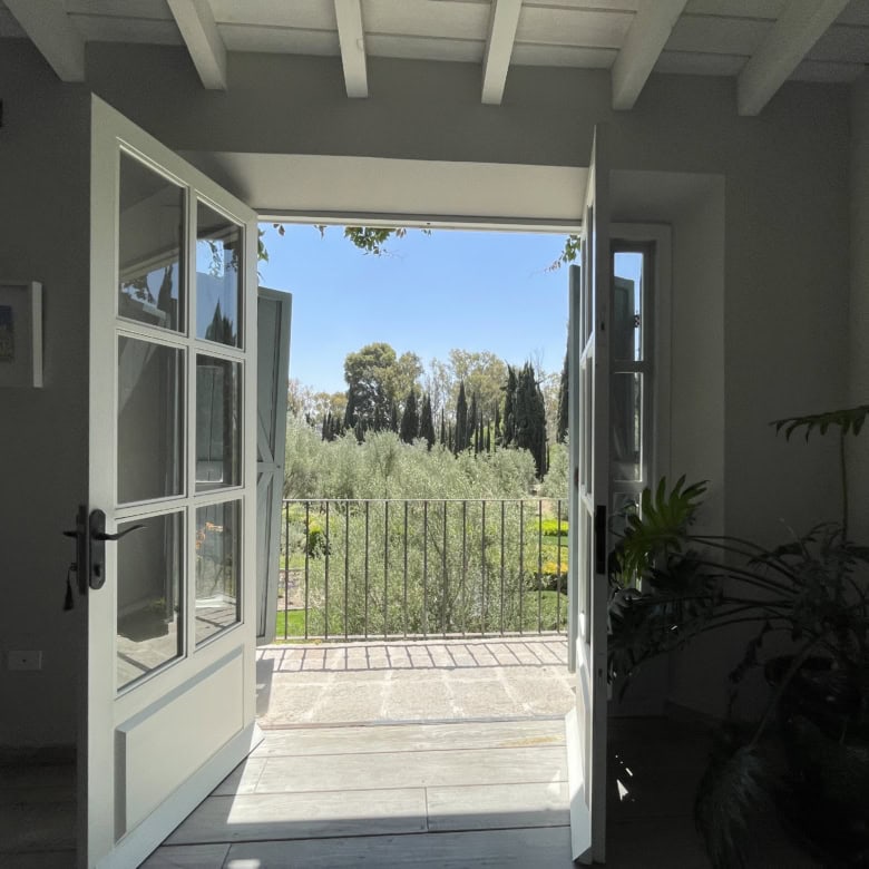 Open balcony with garden view and natural light.