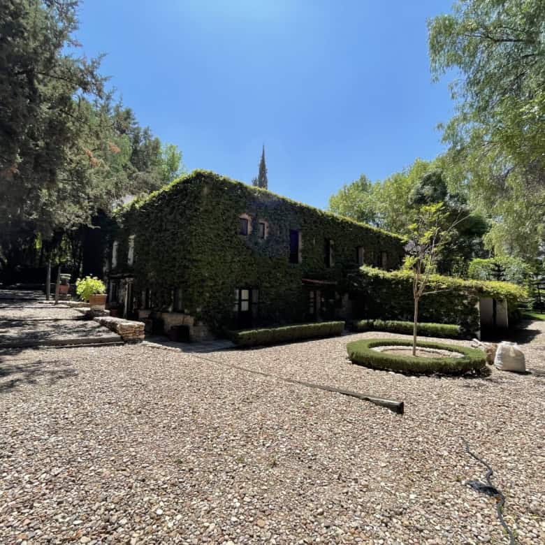 Luxury countryside villa with lush gardens and scenic views.